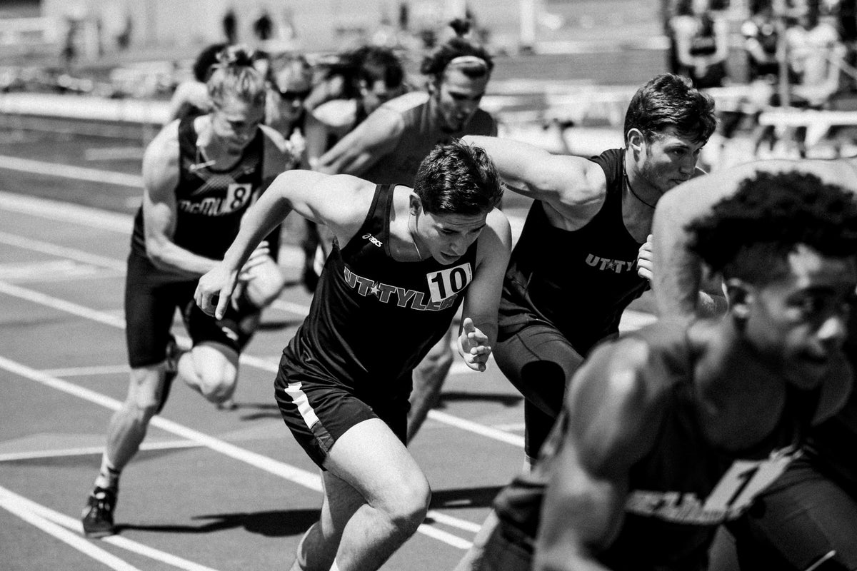 Runners during a marathon, black and white